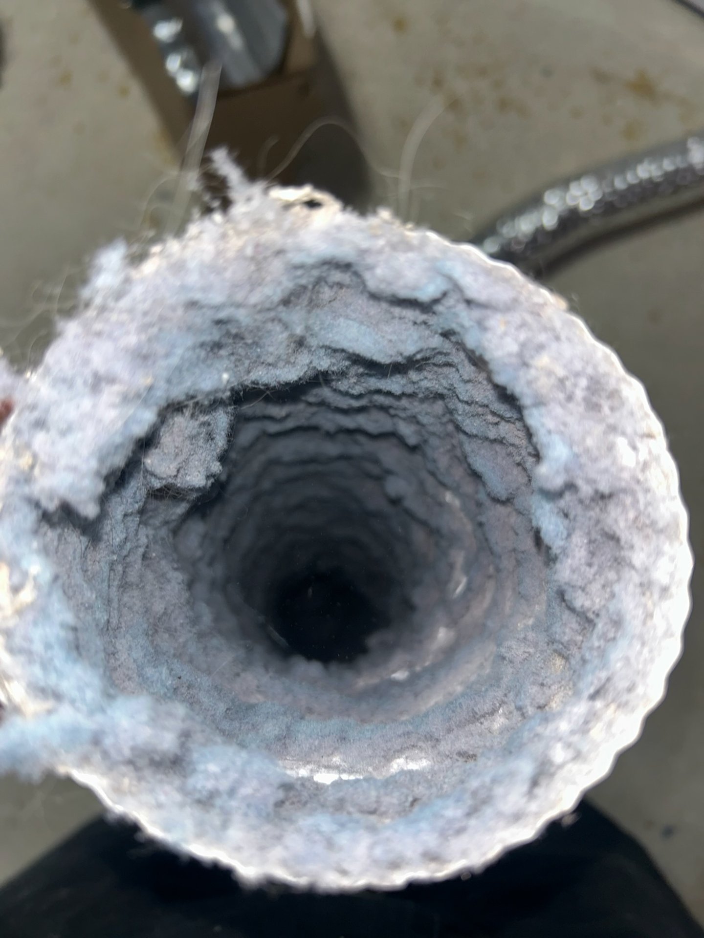 Solid lint chunk pulled from a dryer duct