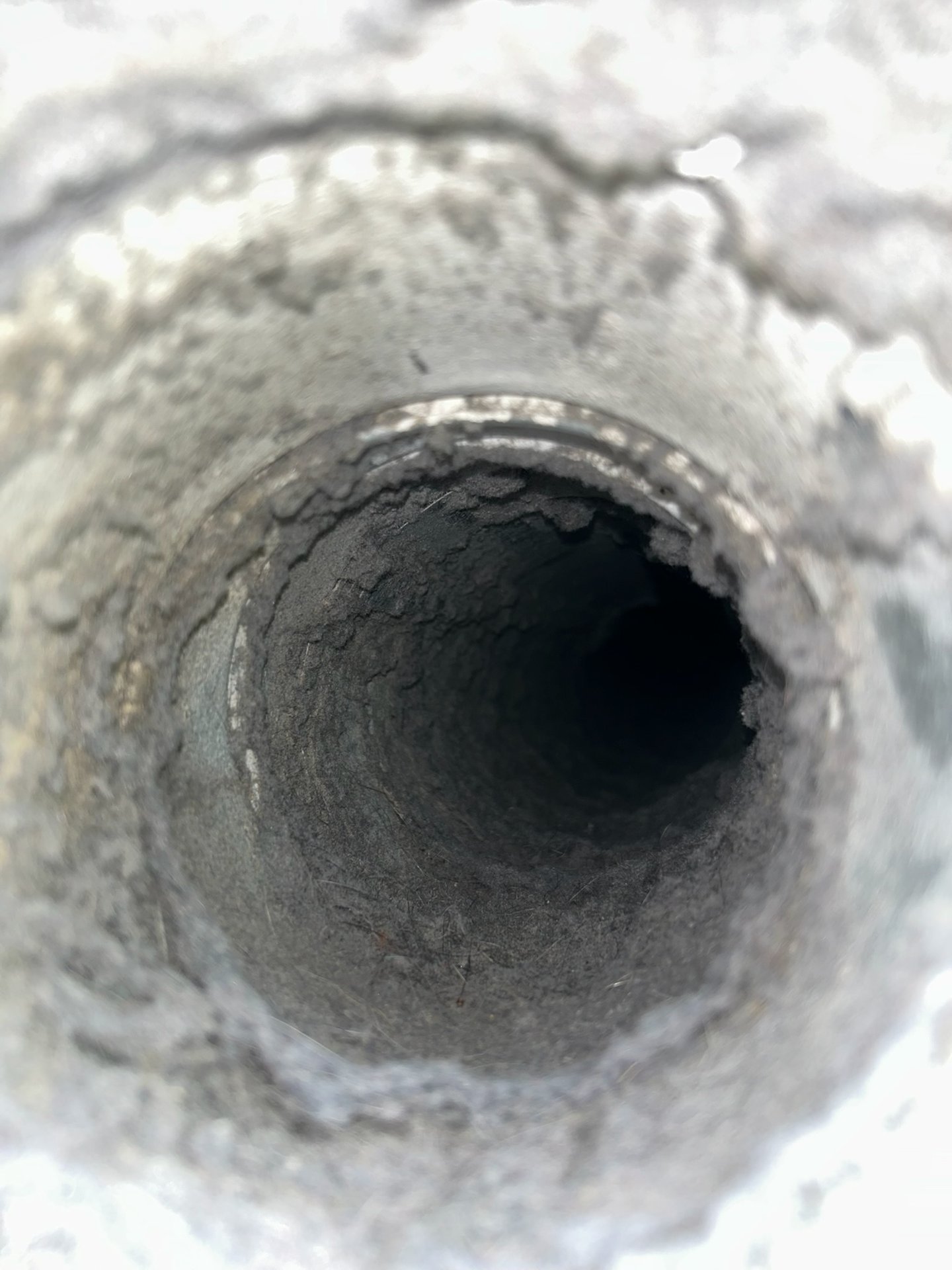 Clogged dryer duct viewed from the vent opening