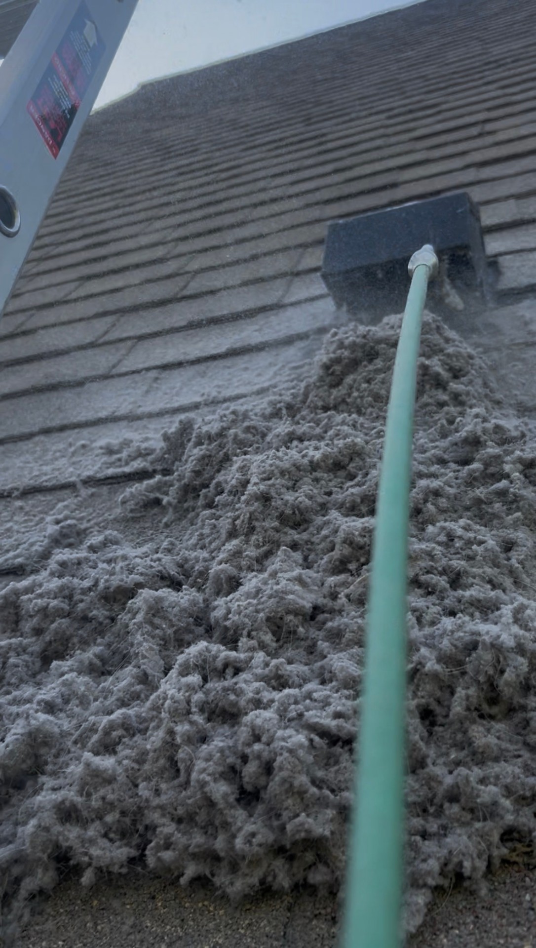 Massive lint blown out of a roof-terminated dryer vent during cleaning