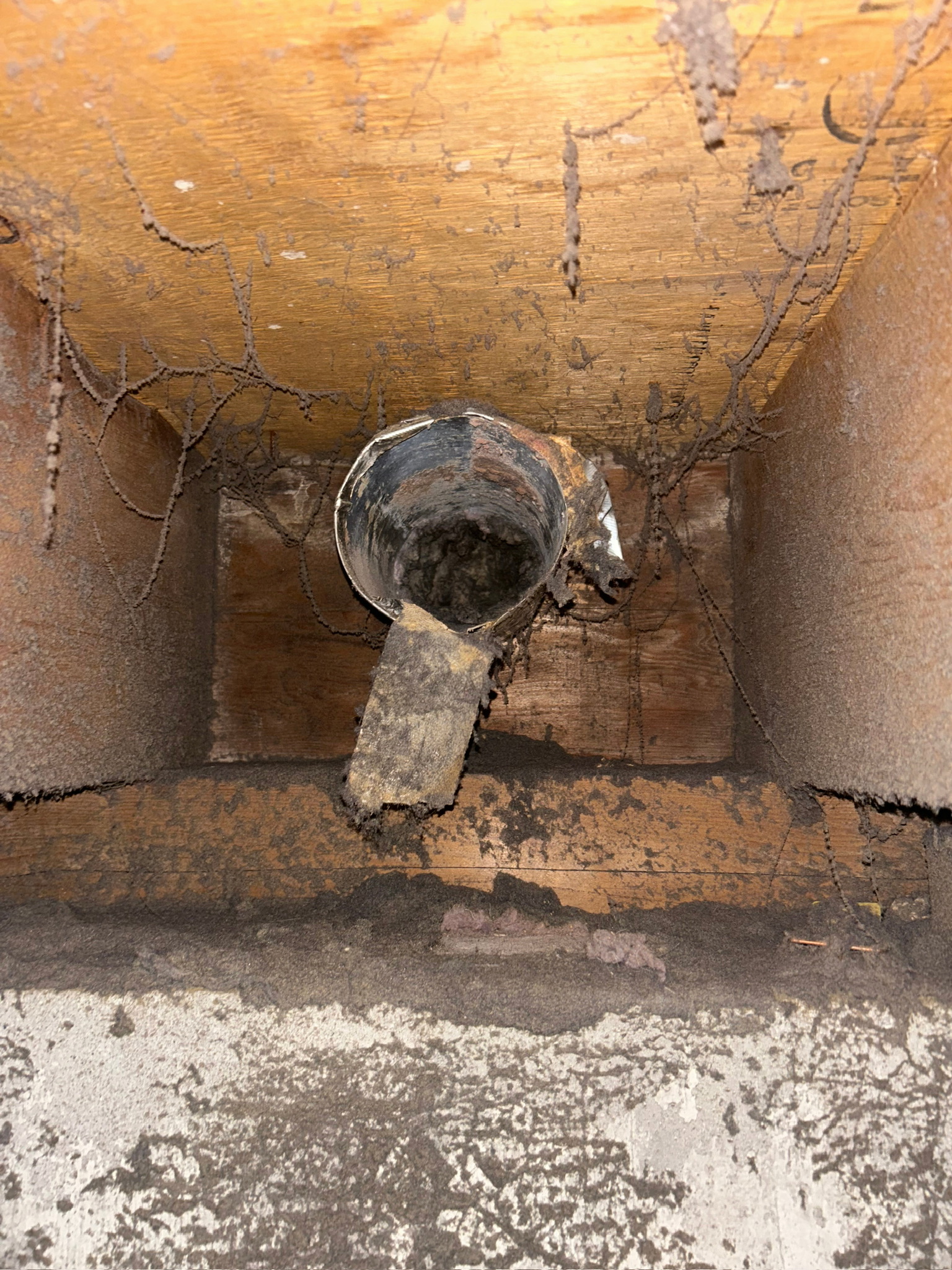 Damaged dryer duct connection in need of repair