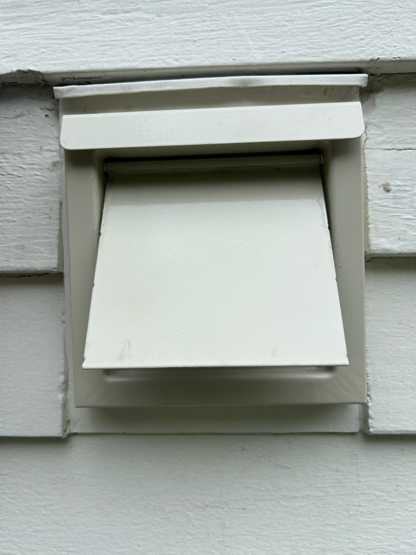 Exterior dryer vent hood, closed position