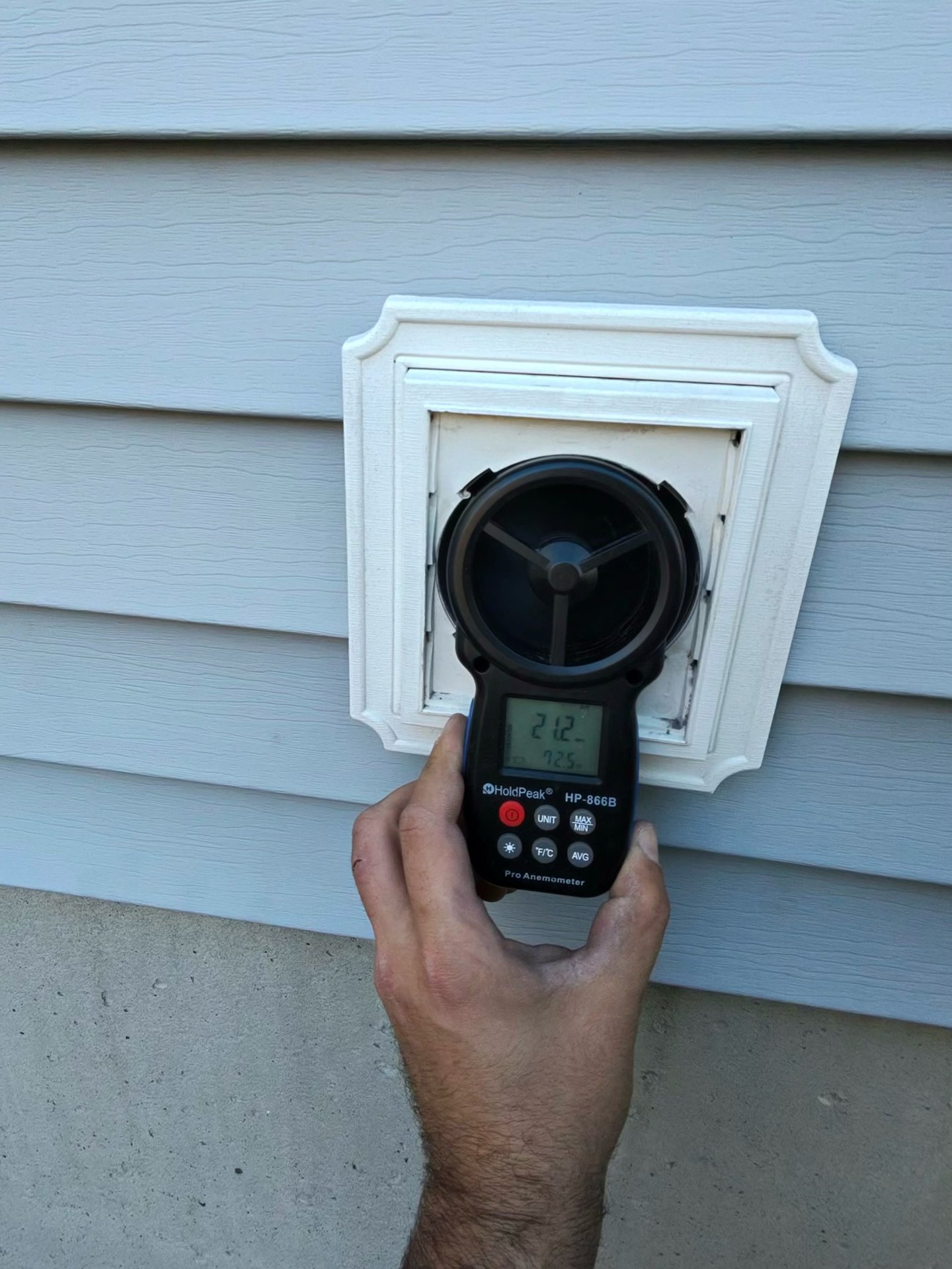 Airflow tester at an exterior dryer vent